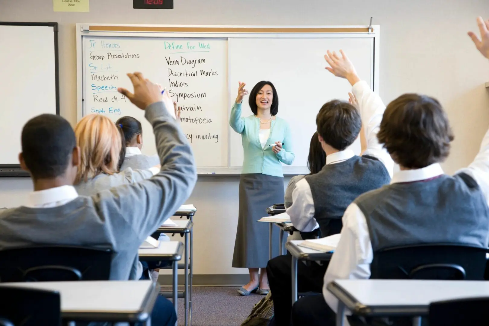 A woman standing in front of a class room