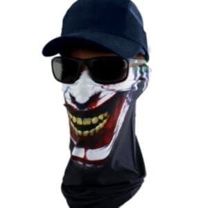 A man wearing sunglasses and a hat with a clown mask on it.