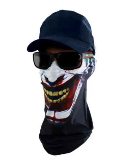 A man wearing sunglasses and a hat with a clown mask on it.