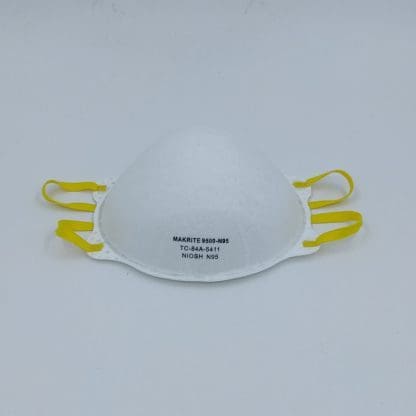 A white mask with yellow straps on top of it.